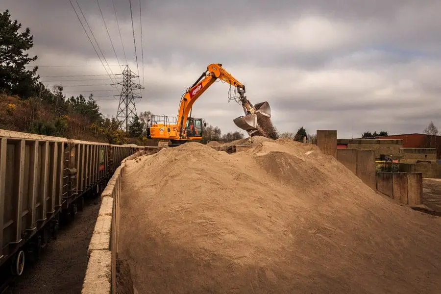  Unloading gravel at a rail siding facility 