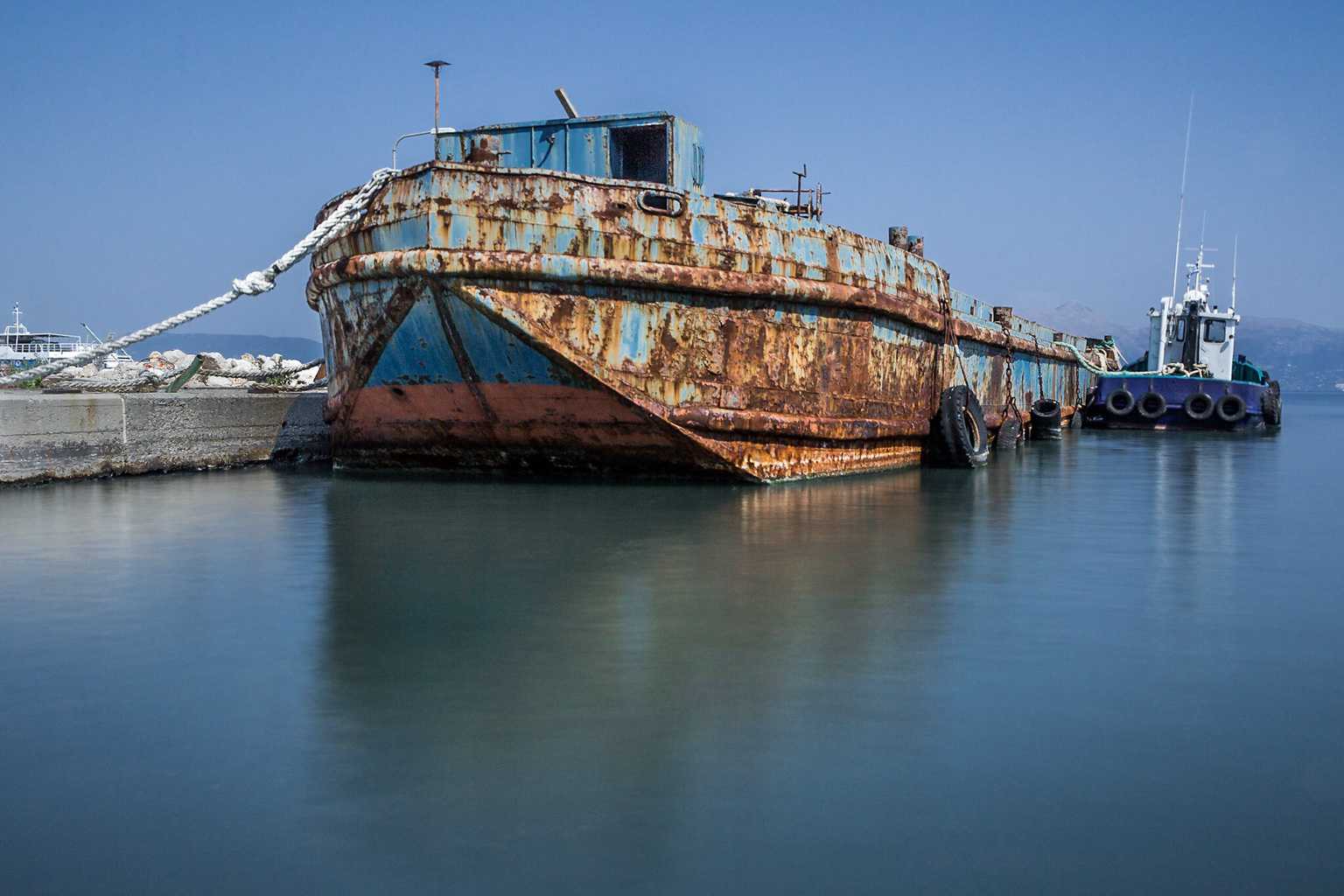  Picture of a rusty boat in the port in Corfu Town by Rick McEvoy industrial photographer   