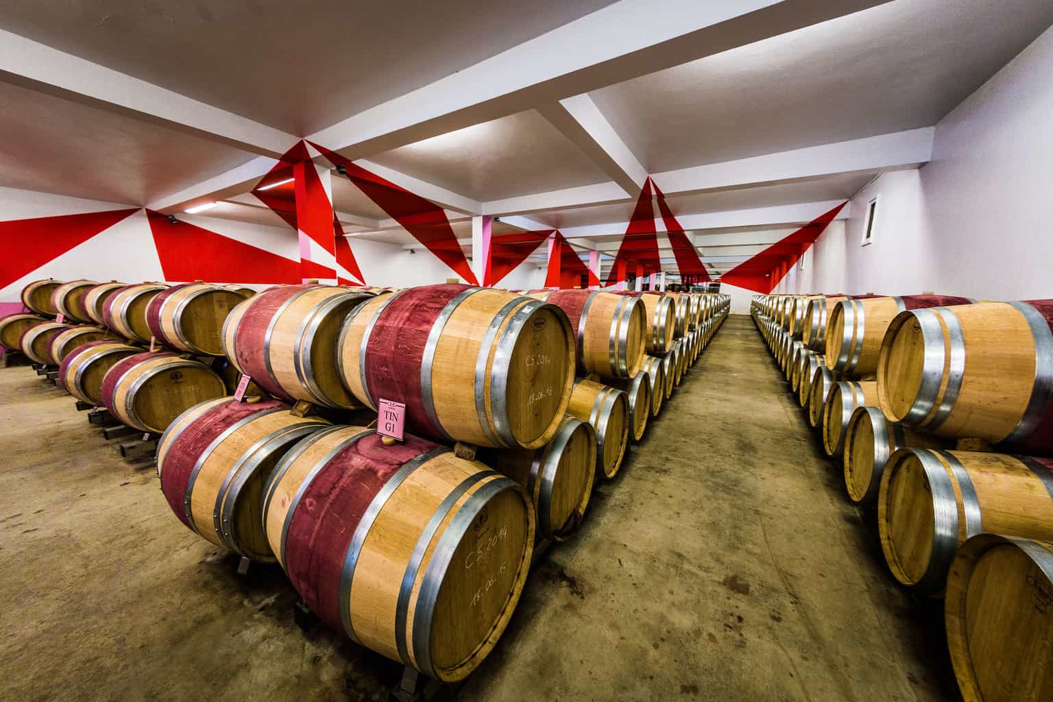  Barrels of wine maturing, Bordeaux, France, by industrial photographer Rick McEvoy 