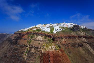 Photo of the white buildings of Imerovigli from Skaros Rock