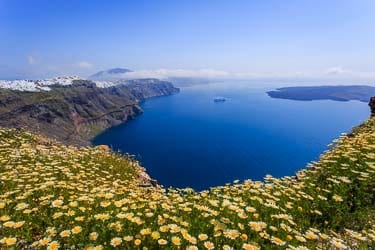 Stunning view of Fira and Nea Kameni Island from Skaros Rock