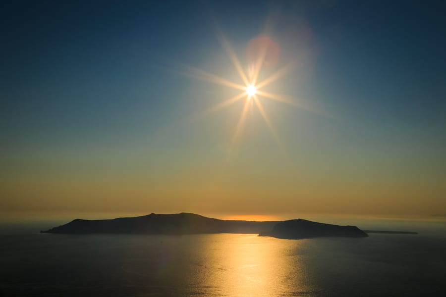 Sunshine view of Thirasia from the mainland of Santorini