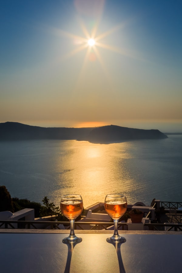 Evening drinks with a sunshine view of the caldera at Kasimatis